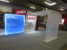 Custom Inline Exhibit with Large LED Lightbox, Expansive Arch with Scrim Fabric, Puck Lights, Storage Closet, and Custom Reception Counter with Locking Storage